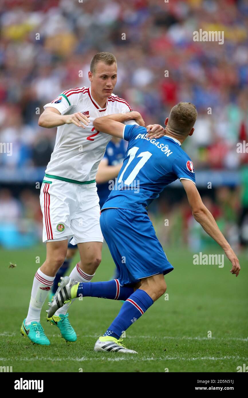 Iceland's Alfred Finnbogason (right) is brought down by Hungary's Adam Lang late in the game  Stock Photo