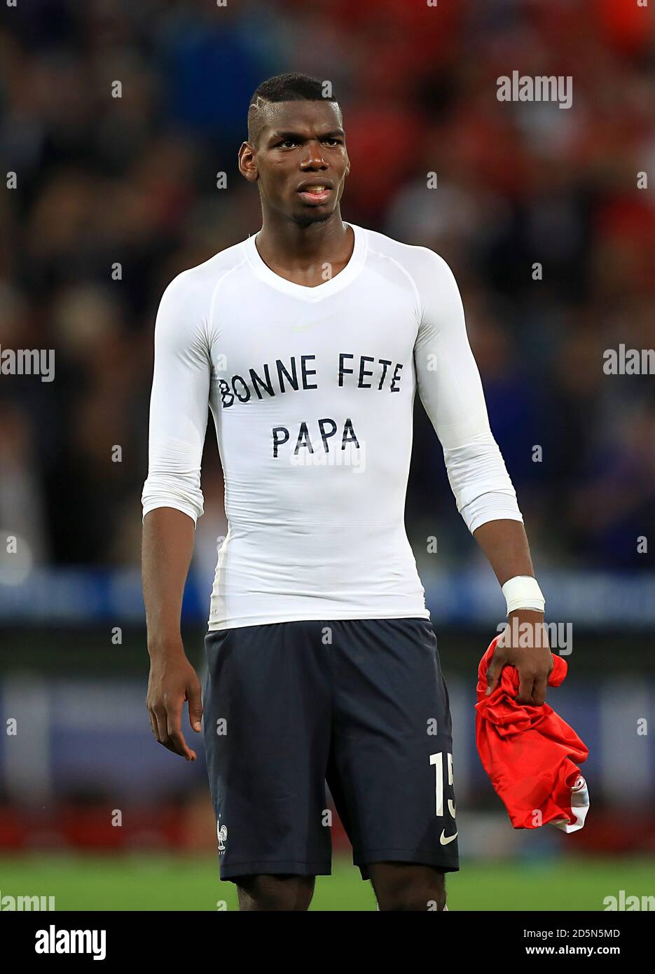 France's Paul Pogba after the final whistle wearing a Bonne Fete Papa t- shirt Stock Photo - Alamy