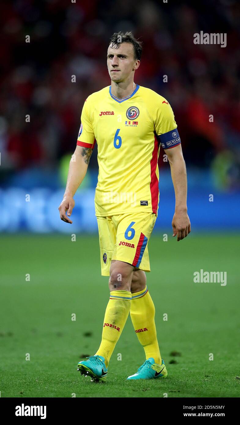 Romania's Vlad Chiriches appears dejected after the final whistle Stock Photo