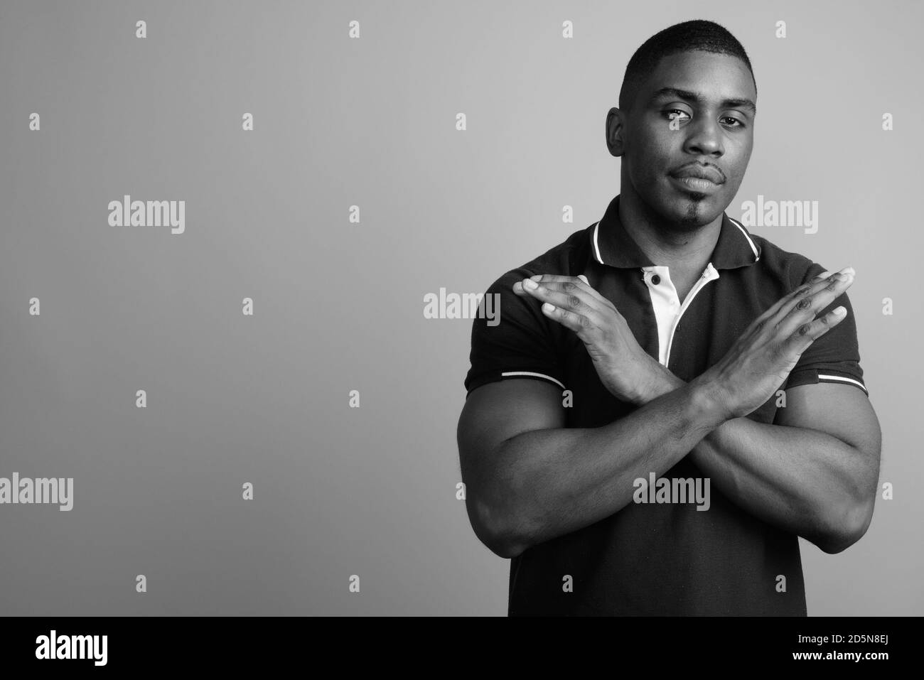 Portrait handsome african guy arms Black and White Stock Photos ...