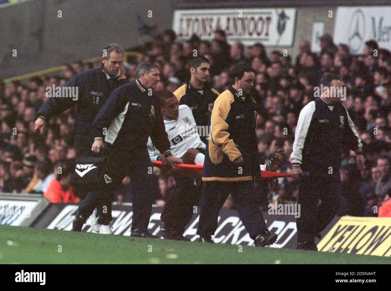 Tottenham Hotspur's Chris Armstrong is carried off Stock Photo Alamy