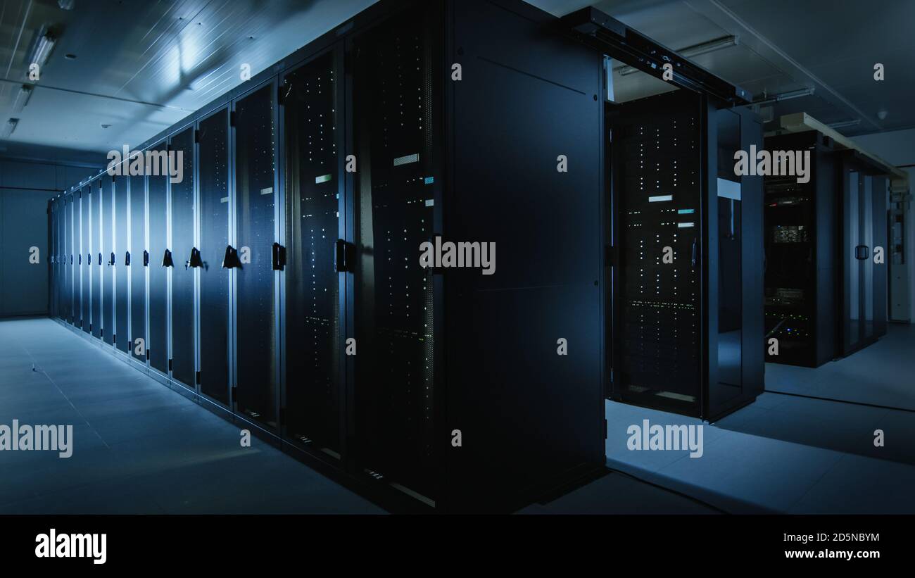 Shot of a Working Data Center With Rows of Rack Servers. Led Lights  Blinking and Computers are Working. Dark Ambient Light Stock Photo - Alamy