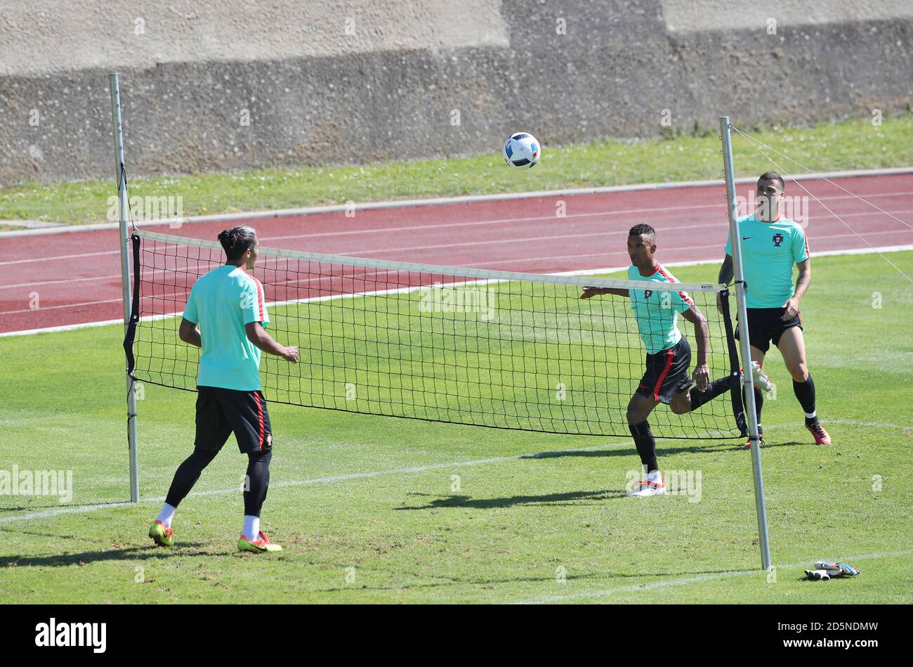 Portugal's Nani (centre), Bruno Alves (left) and Vieirinha playing vollyball during a training session in Marcoussis, Paris. Stock Photo