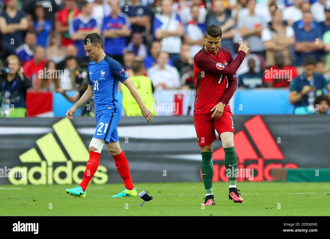 Portugal's Cristiano Ronaldo throws his captains armband onto the pitch