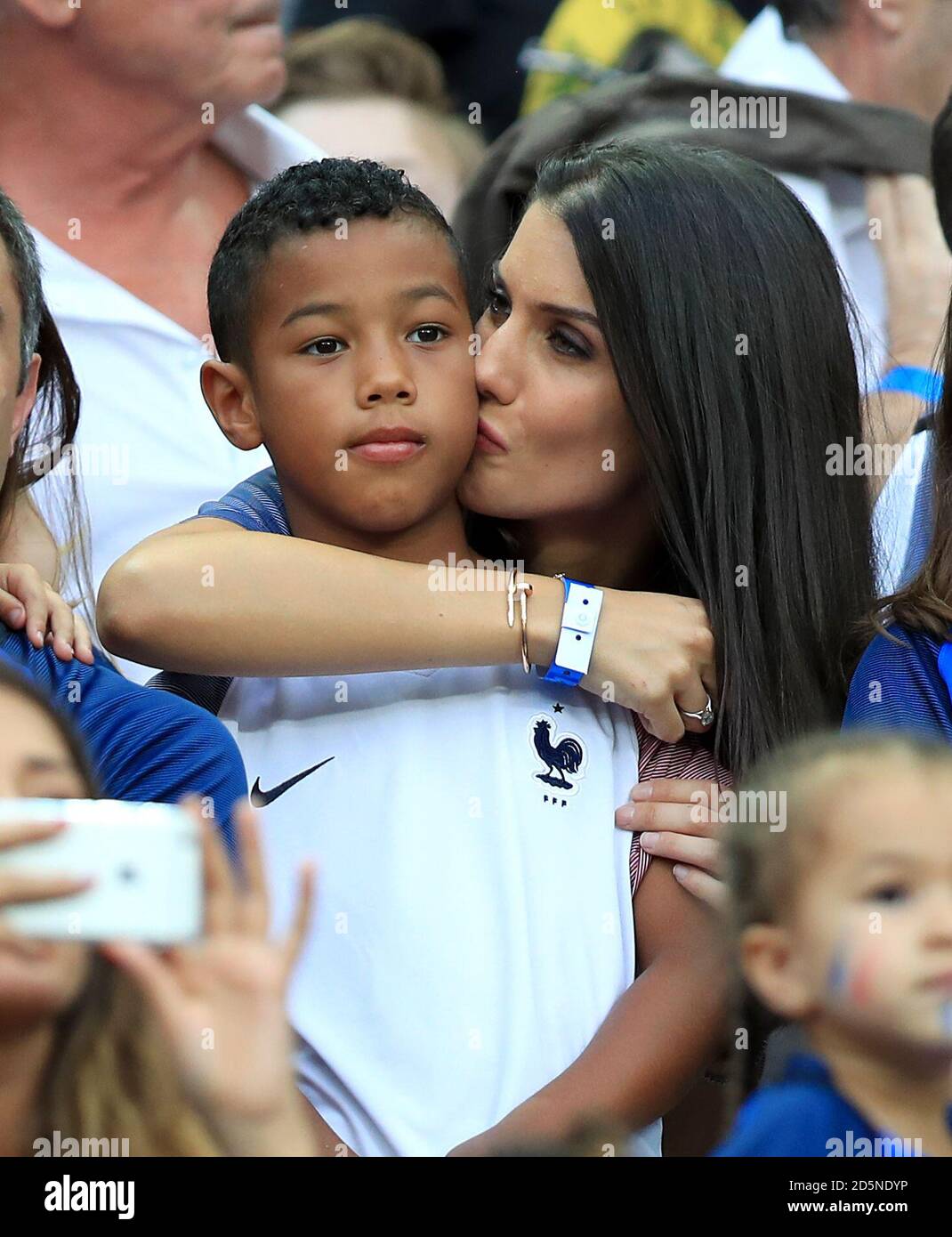 Ludivine Sagna, wife of France's Bacary Sagna and their son Elias in the stands before the game. Stock Photo