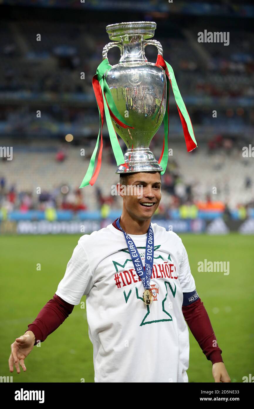 portugal-s-cristiano-ronaldo-celebrates-on-the-pitch-with-the-trophy