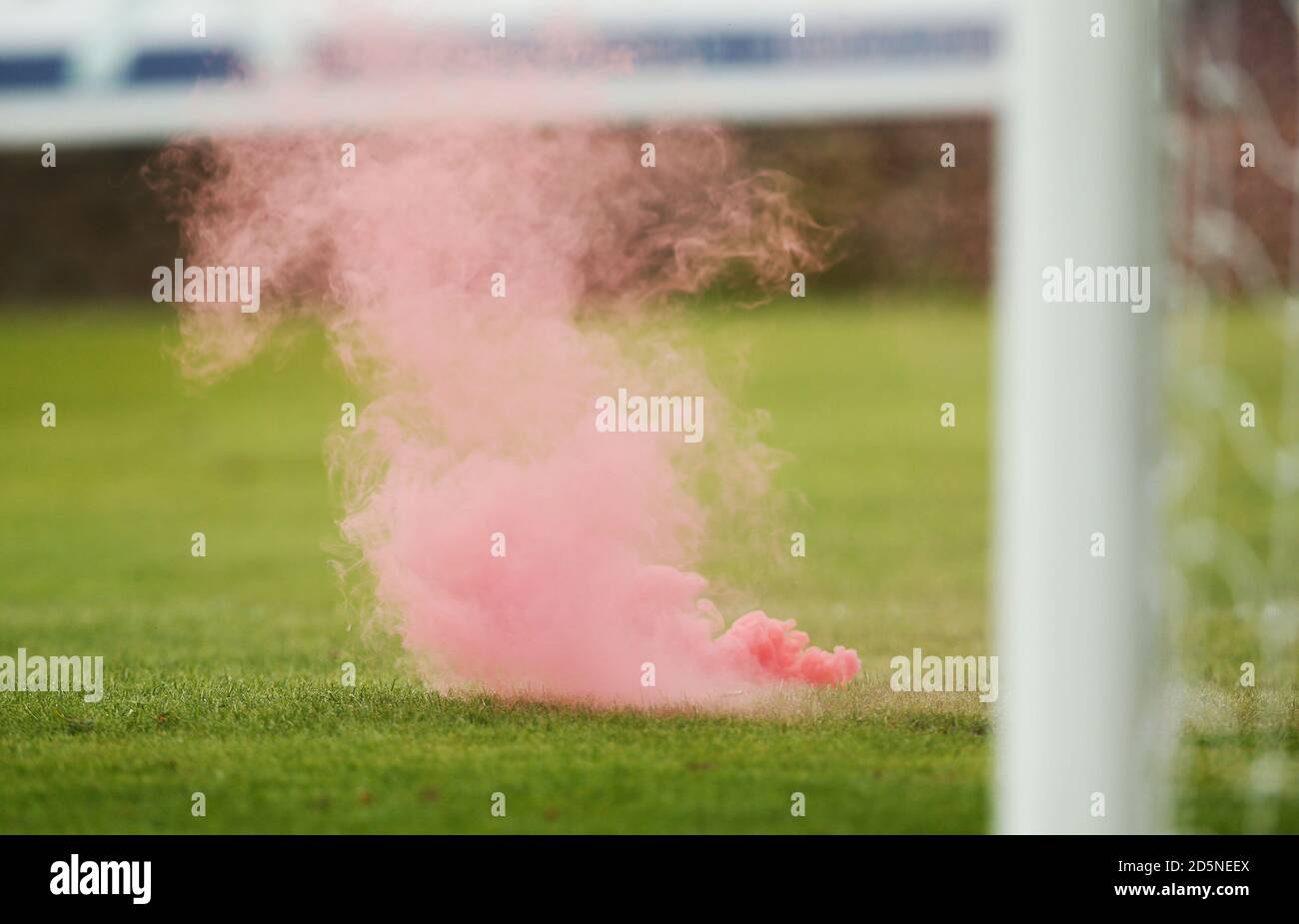 A smoke bomb is thrown on to the pitch during the game Stock Photo Alamy