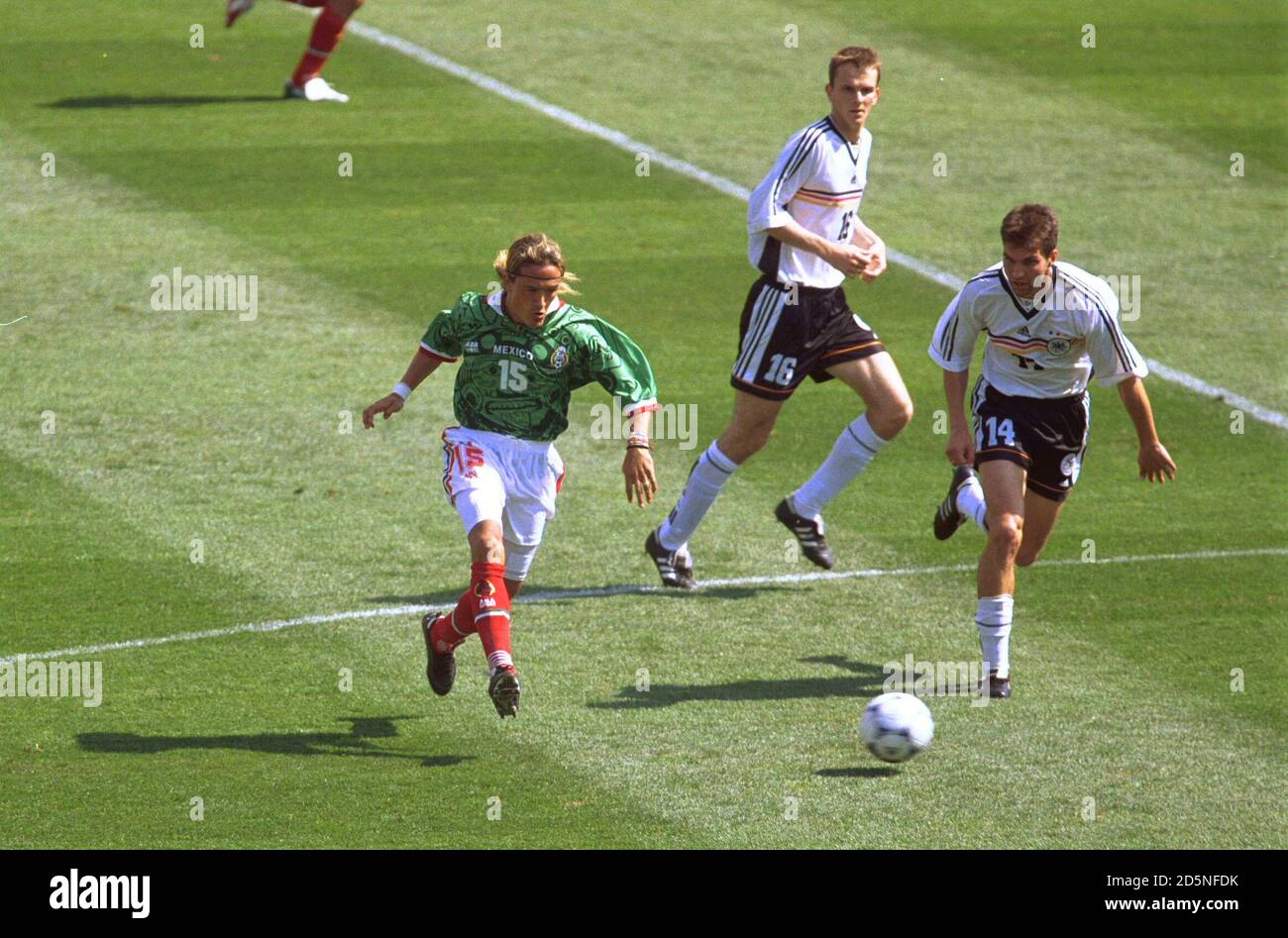 Germany's Markus Babbel (right) tracks Luis Hernandez of Mexico (left) Stock Photo