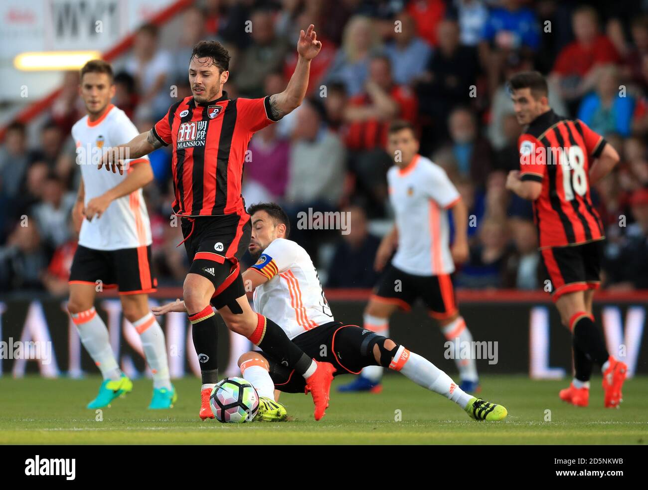 AFC Bournemouth's Adam Smith is tackled by Valencia's Javi Fuego (right) Stock Photo