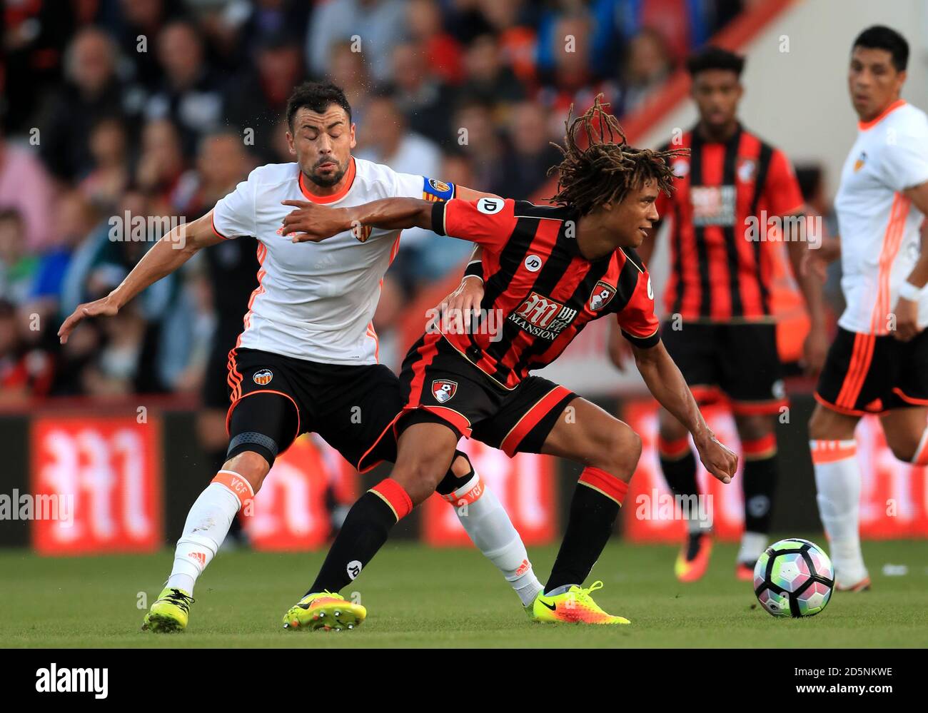 AFC Bournemouth's Nathan Ake (right) battles for possession of the ball with  Valencia's Javi Fuego (left) Stock Photo