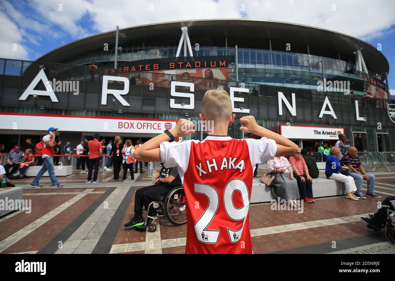 A young Arsenal wearing a shirt with new signing Granit Xhaka's name on his back before the game against Liverpool. Stock Photo