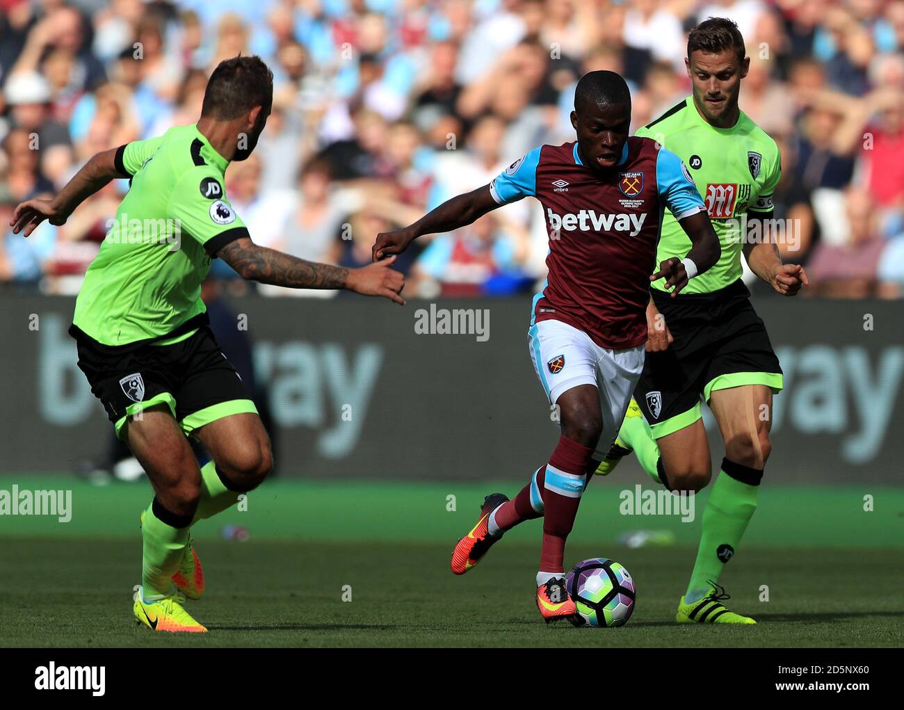 West Ham United's Enner Valencia (centre) and AFC Bournemouth's Simon Francis battle for the ball Stock Photo