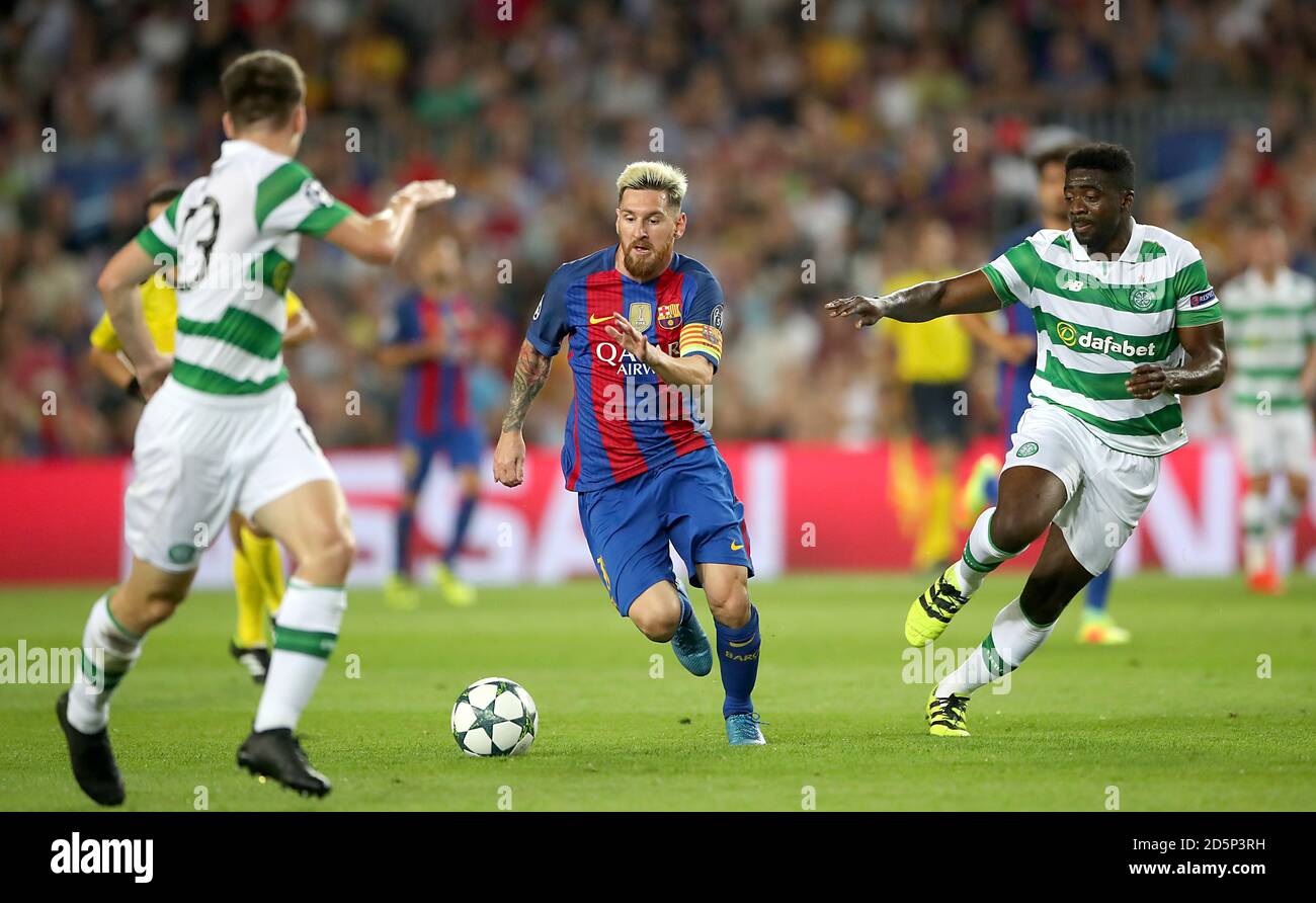 Barcelona's Lionel Messi and Celtic's Kolo Toure battle for the ball Stock Photo
