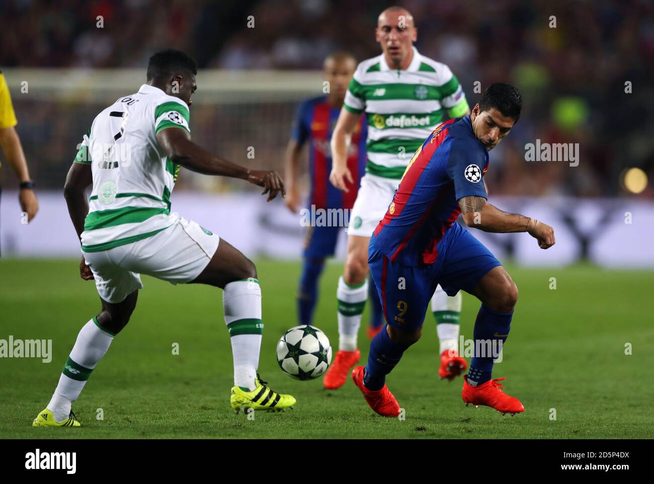 Barcelona's Luis Suarez (right) and Celtic's Kolo Toure battle for the ball Stock Photo