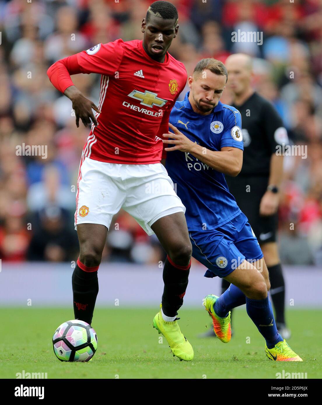 Manchester United's Paul Pogba (left) and Leicester City's Danny Drinkwater battle for the ball Stock Photo