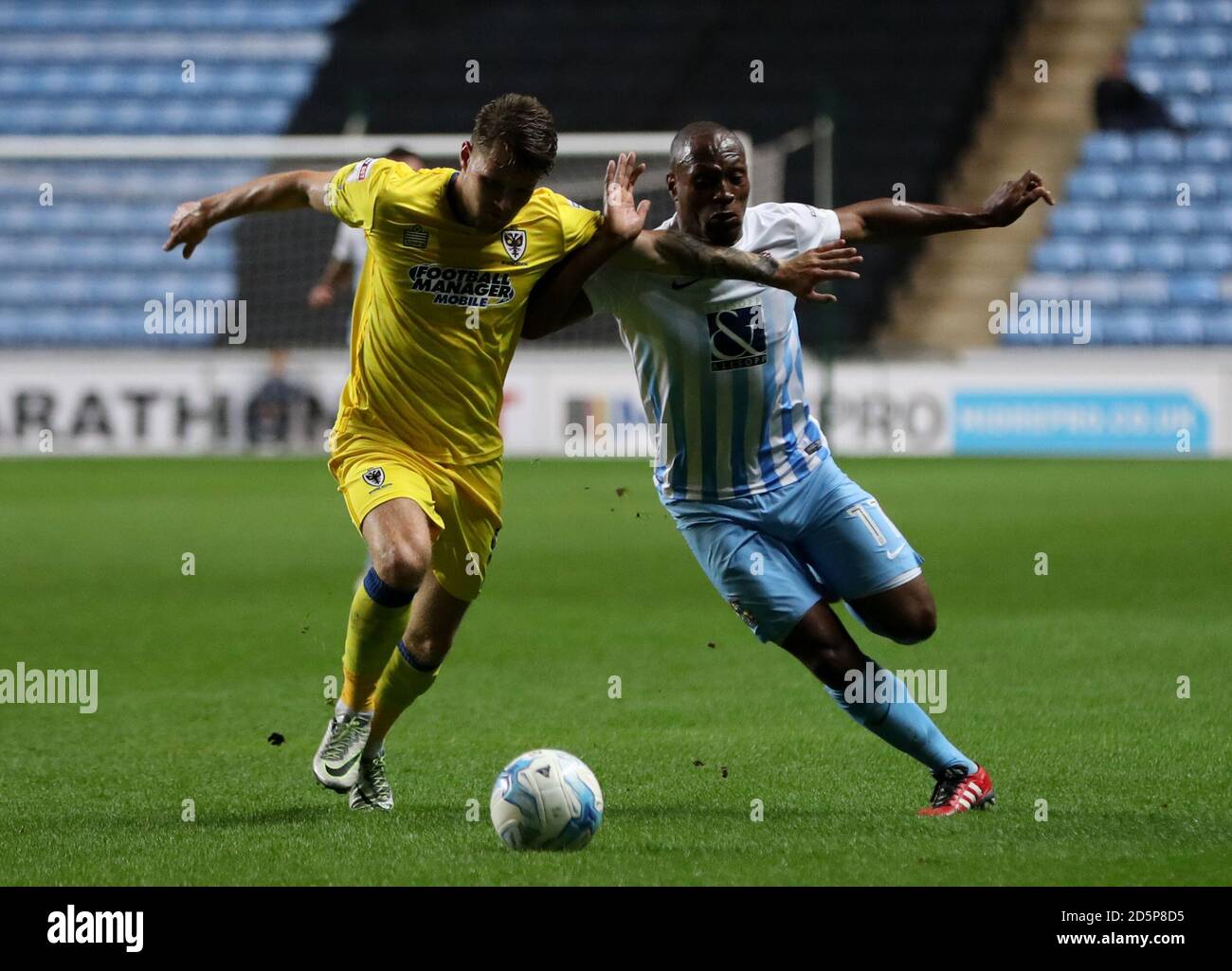 Coventry City's Kyel Reid (right) and AFC Wimbledon's Jake Reeves ...