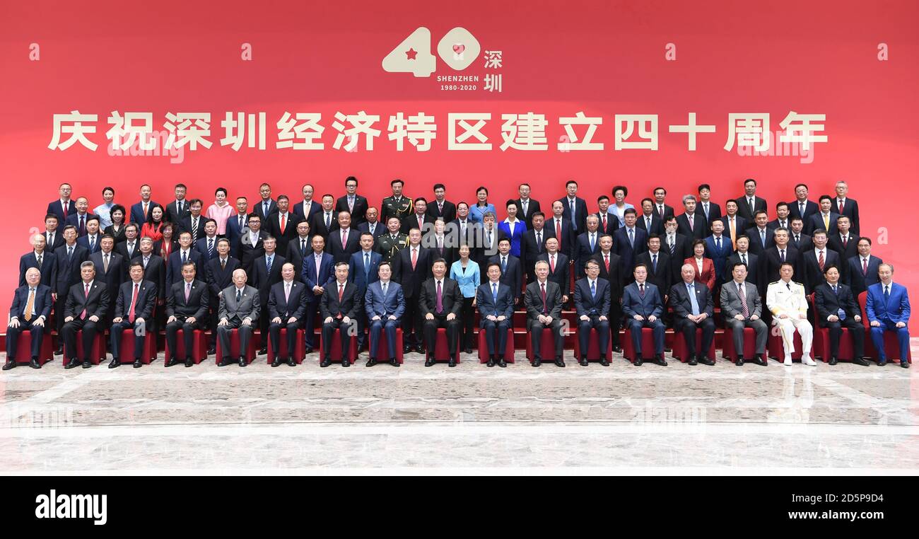 Shenzhen, China's Guangdong Province. 14th Oct, 2020. Chinese President Xi Jinping, also general secretary of the Communist Party of China Central Committee and chairman of the Central Military Commission, poses for a group photo with participants of a grand gathering held to celebrate the 40th anniversary of the establishment of the Shenzhen Special Economic Zone in Shenzhen, south China's Guangdong Province, Oct. 14, 2020. Xi attended the gathering and delivered an important speech on Wednesday. Credit: Zhang Ling/Xinhua/Alamy Live News Stock Photo