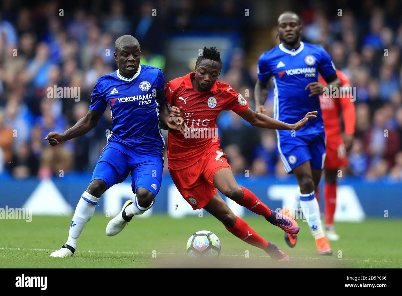 Chelsea's N'Golo Kante (left) and Leicester City's Ahmed Musa battle for the ball  Stock Photo