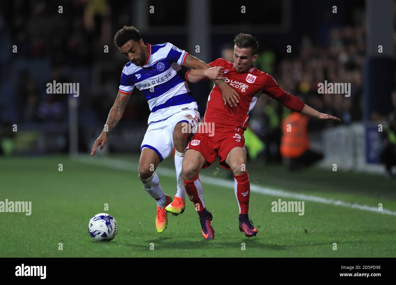 Bristol City's Joe Bryan, (left) battles for the ball with Queens Park Rangers' James Perch, (right) Stock Photo