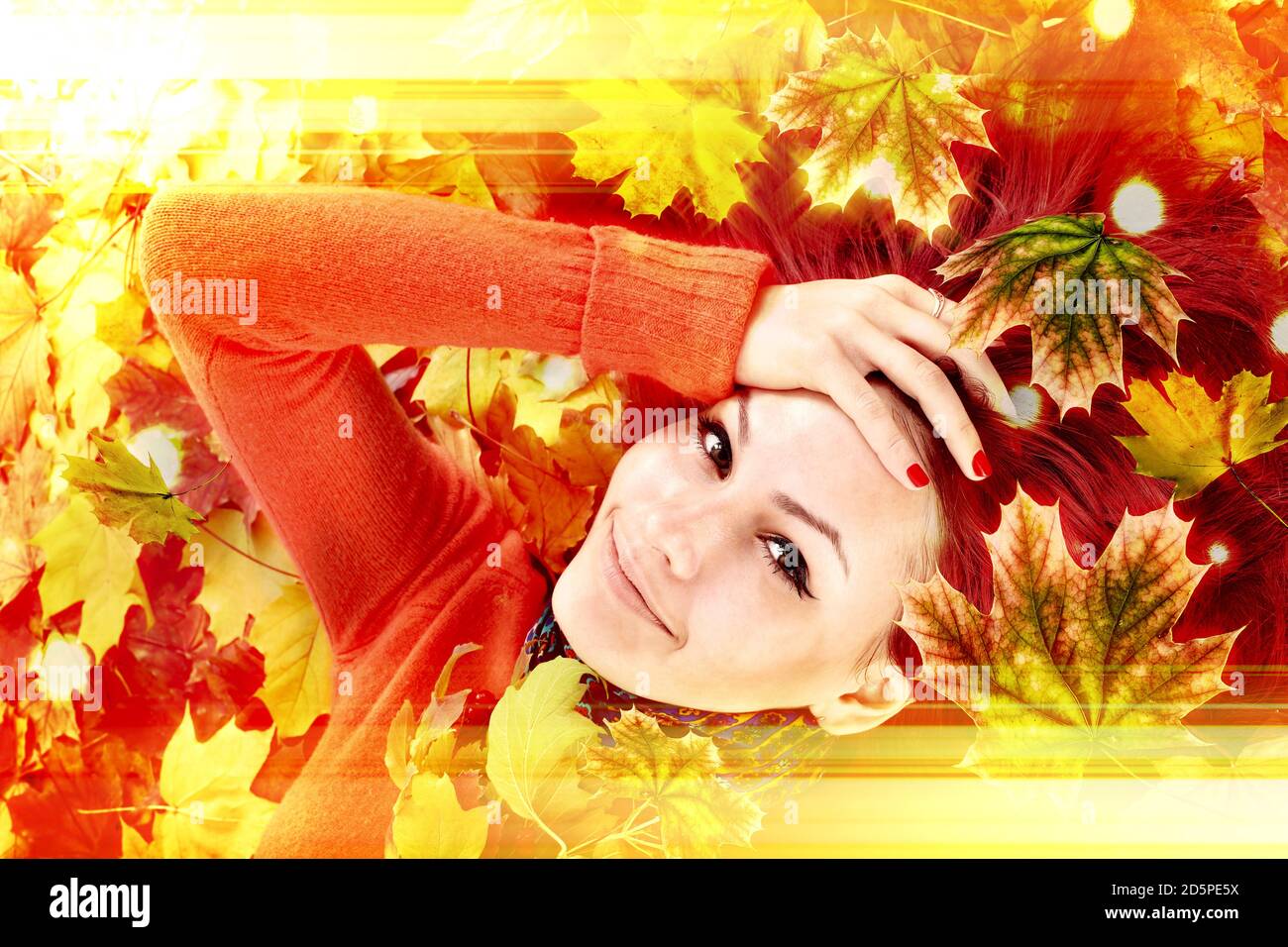Autumn leaves light with girl. Happy person lights Stock Photo
