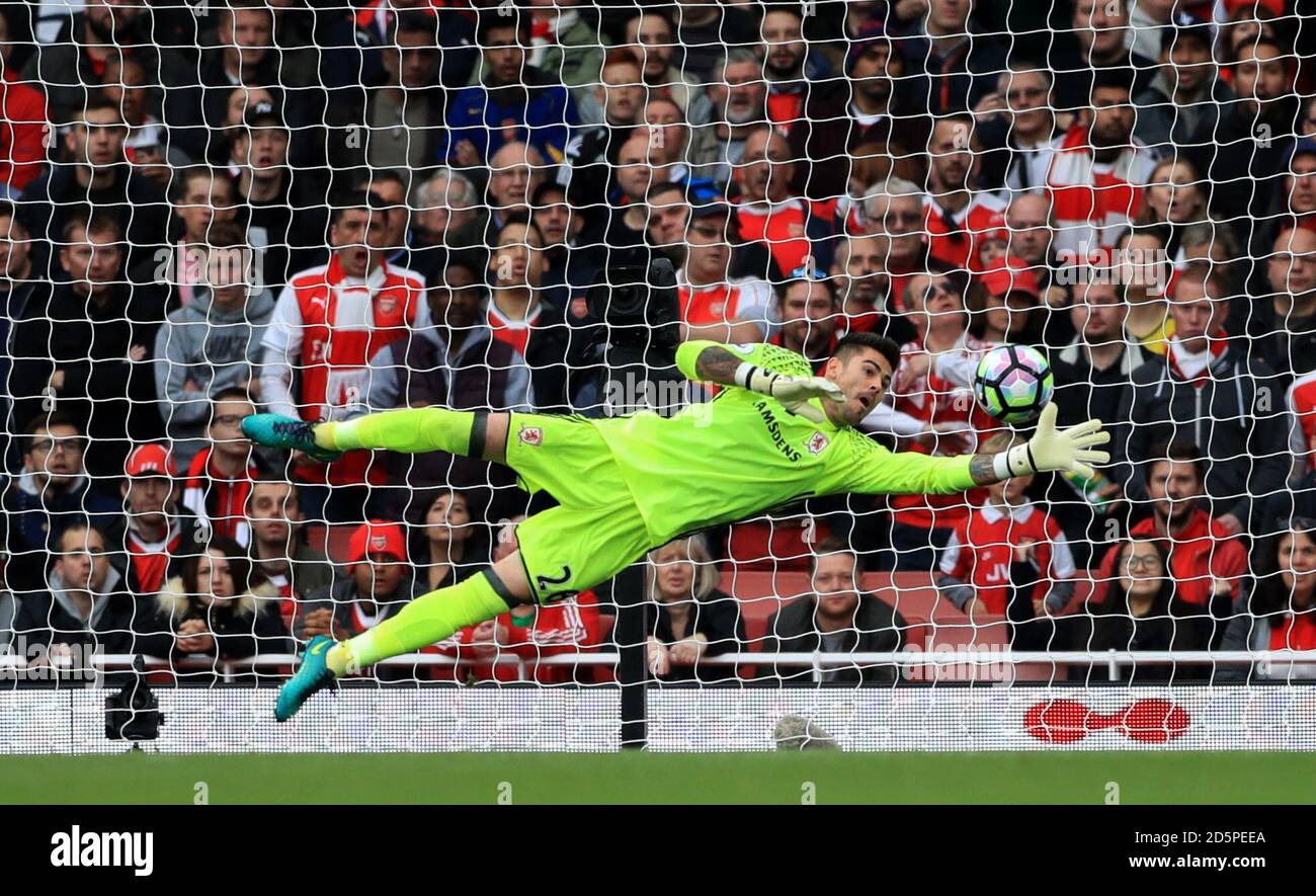 Middlesbrough goalkeeper Victor Valdes dives full length to keep out another effort on goal Stock Photo