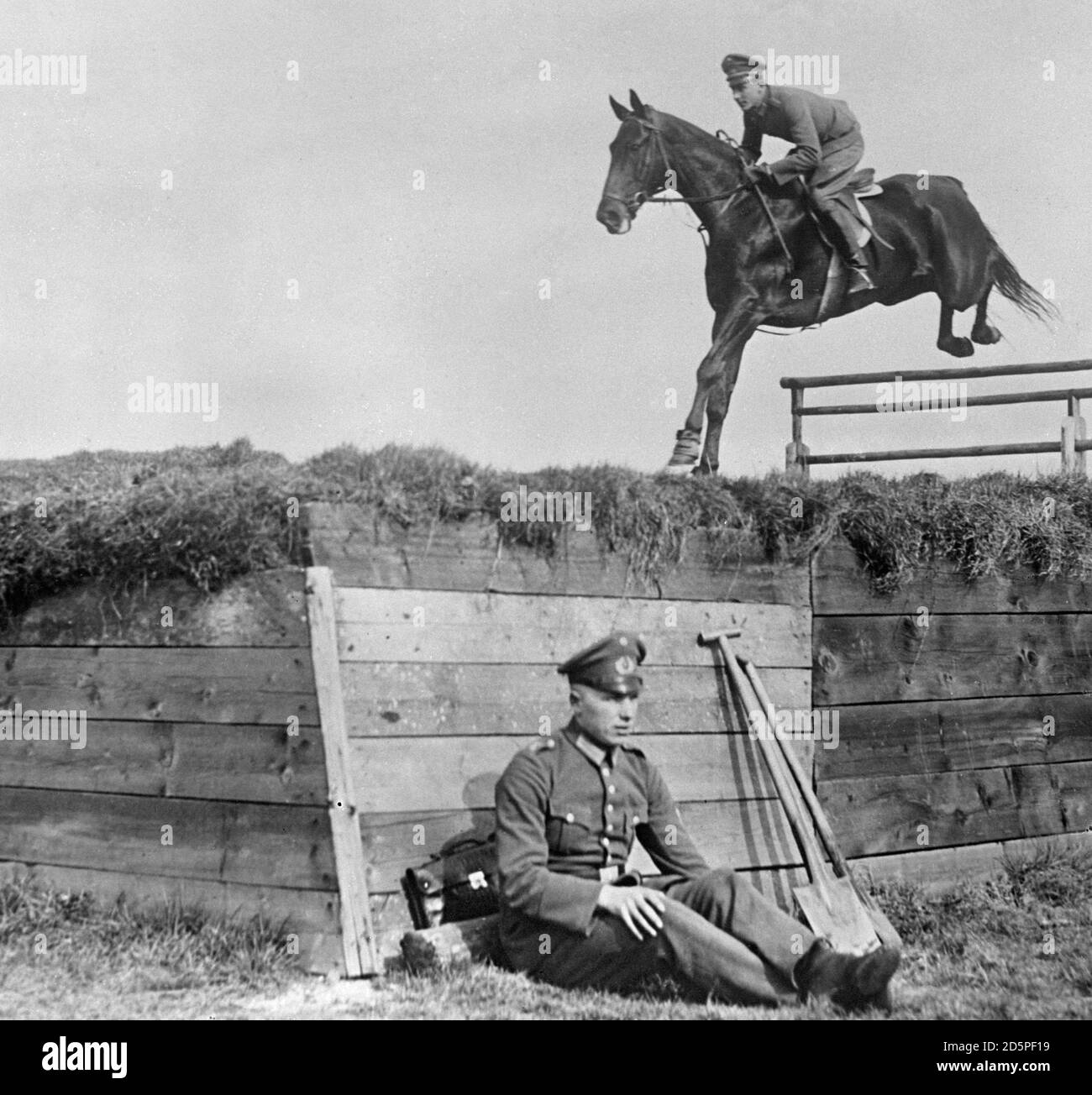 A fine jump by a German competitor at the International Military Riding Tournament in Rome in which soldier horsemen from across Europe compete. Stock Photo