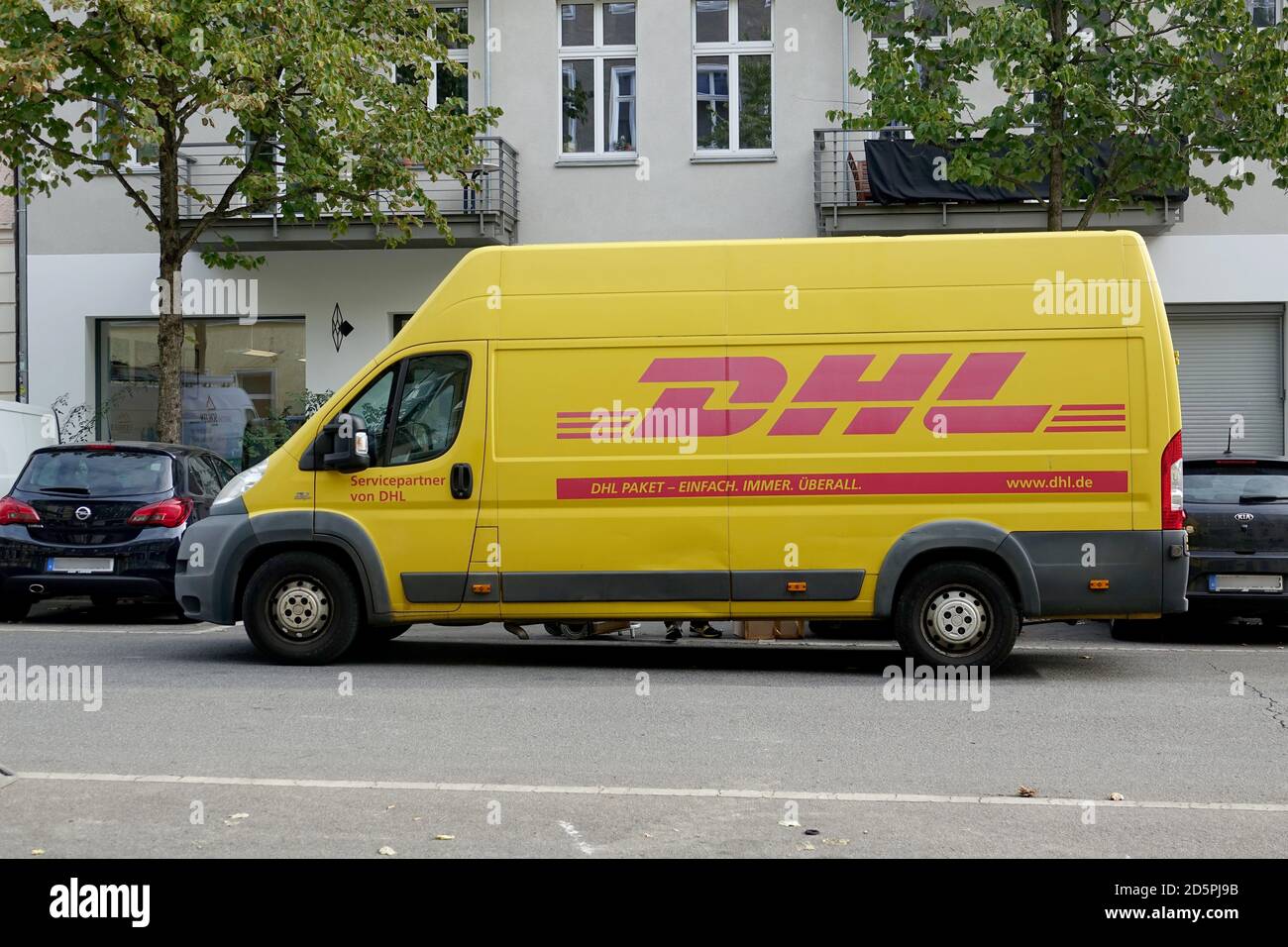 Berlin, Germany. 06th Oct, 2020. A transporter with the DHL label of the  parcel service of the Deutsche Post DHL Group. Credit: Alexandra  Schuler/dpa/Alamy Live News Stock Photo - Alamy