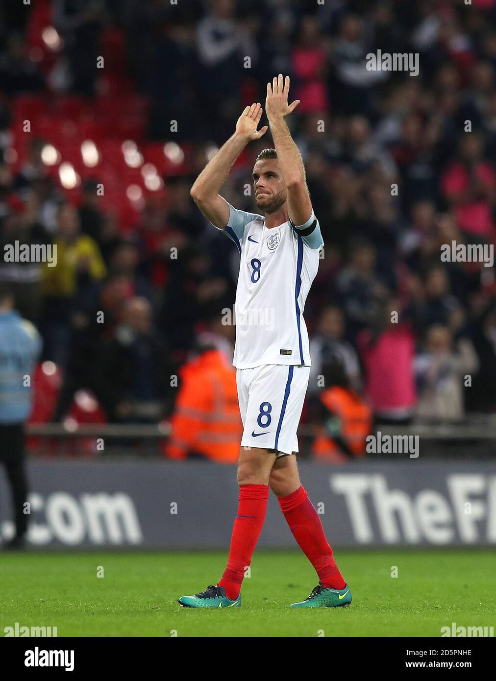 England's Jordan Henderson applauds the fans after the game Stock Photo
