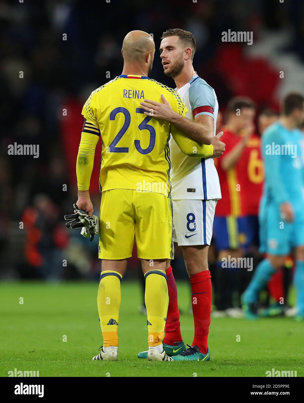 Spain goalkeeper Pepe Reina (left) hugs former club-mate England's Jordan Henderson after the game Stock Photo