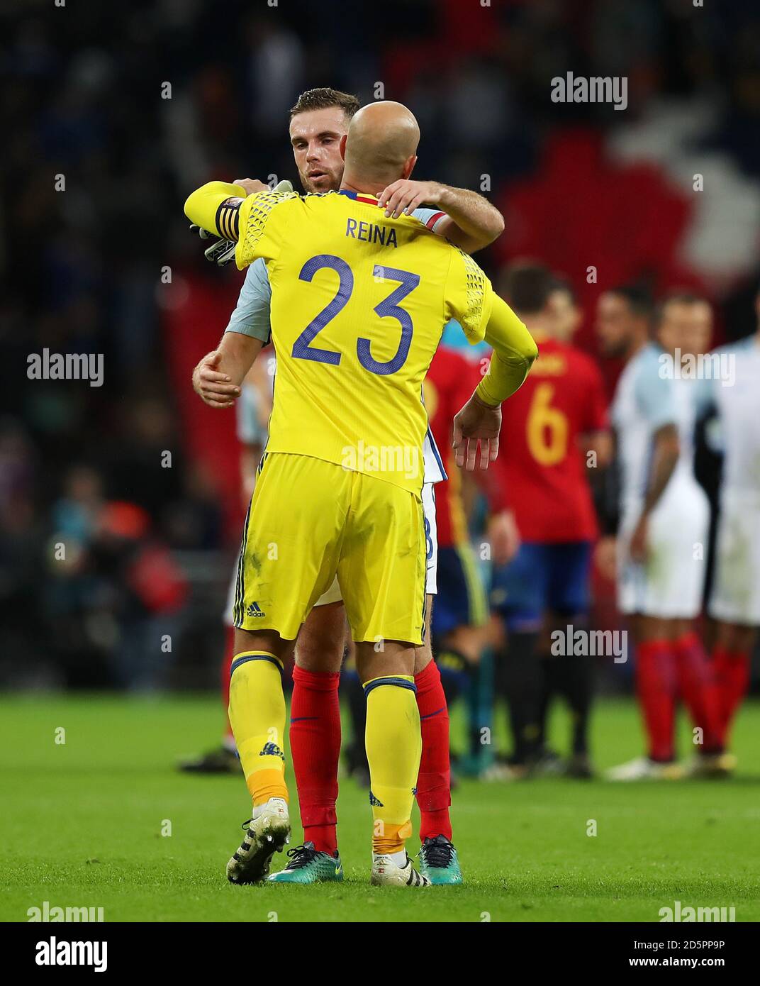 Spain goalkeeper Pepe Reina (right) hugs former club-mate England's Jordan Henderson after the game Stock Photo