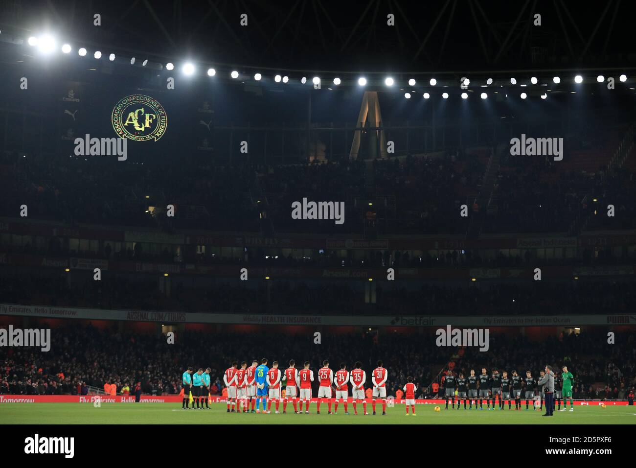 Arsenal and Southampton players stand for a minute's silence before the game to remember the players and staff of Chapecoense football club Stock Photo