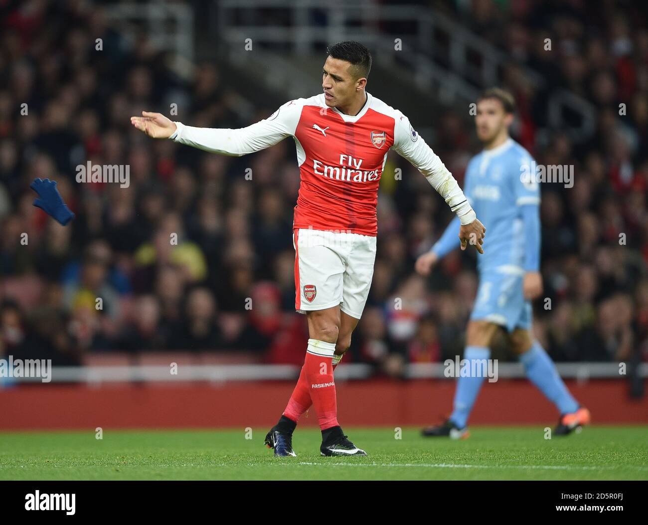 Arsenal's Alexis Sanchez throws away his gloves Stock Photo Alamy