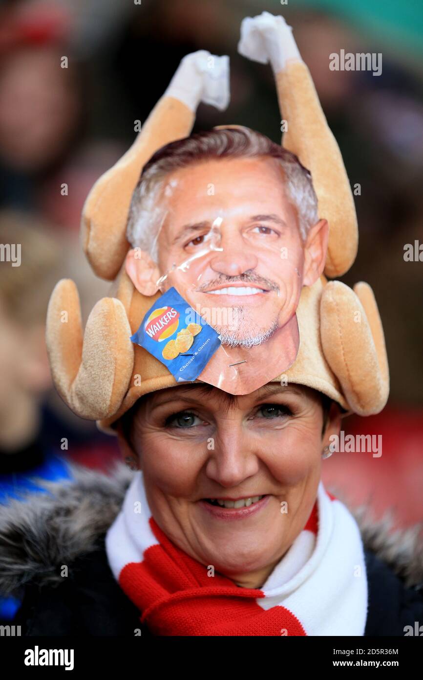 Festive Stoke City supporters in the stands wears a Gary Lineker hat  Stock Photo