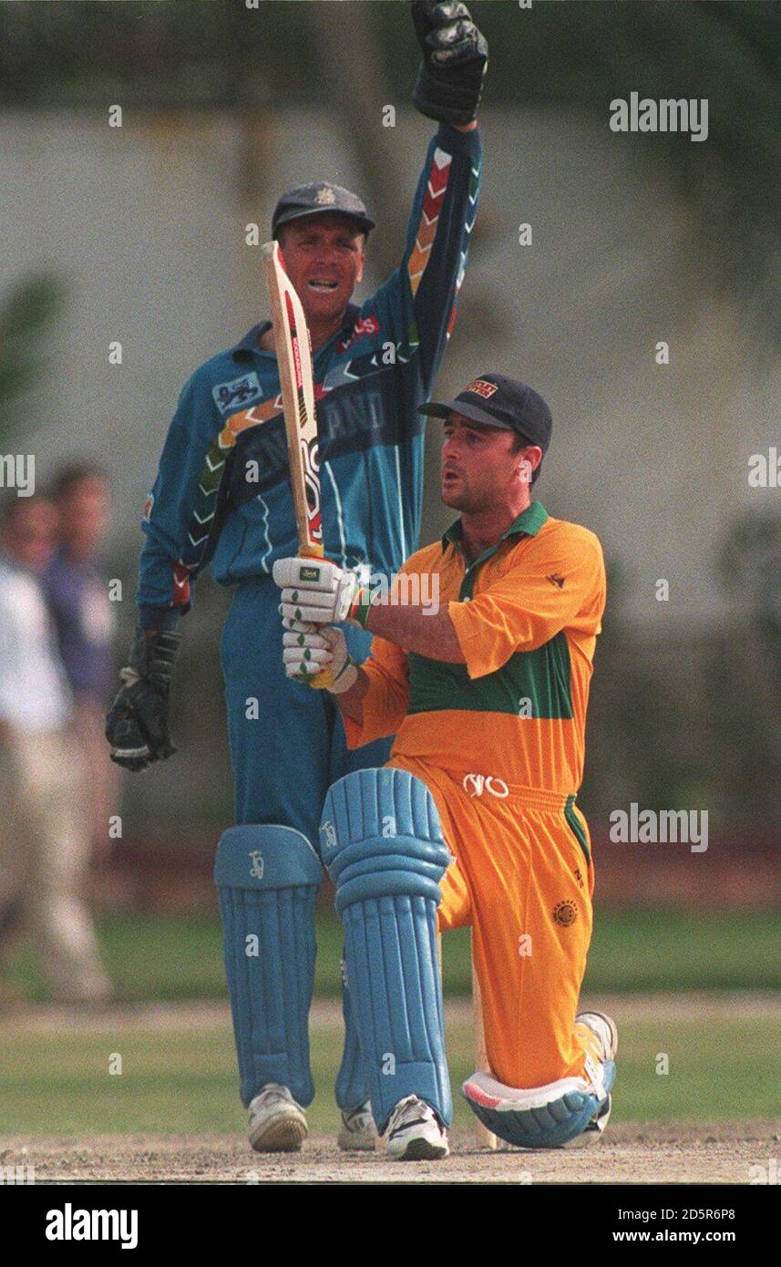 England wicketkeeper Alec Stewart (left) appeals for LBW against Graham Thorpe (right) who is playing for Karachi Gymkhana Stock Photo