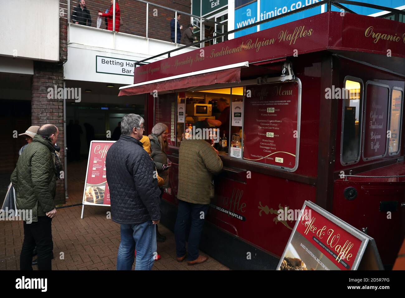 Racegoers at the Coffee & Waffle stall at Cheltenham Racecourse Stock
