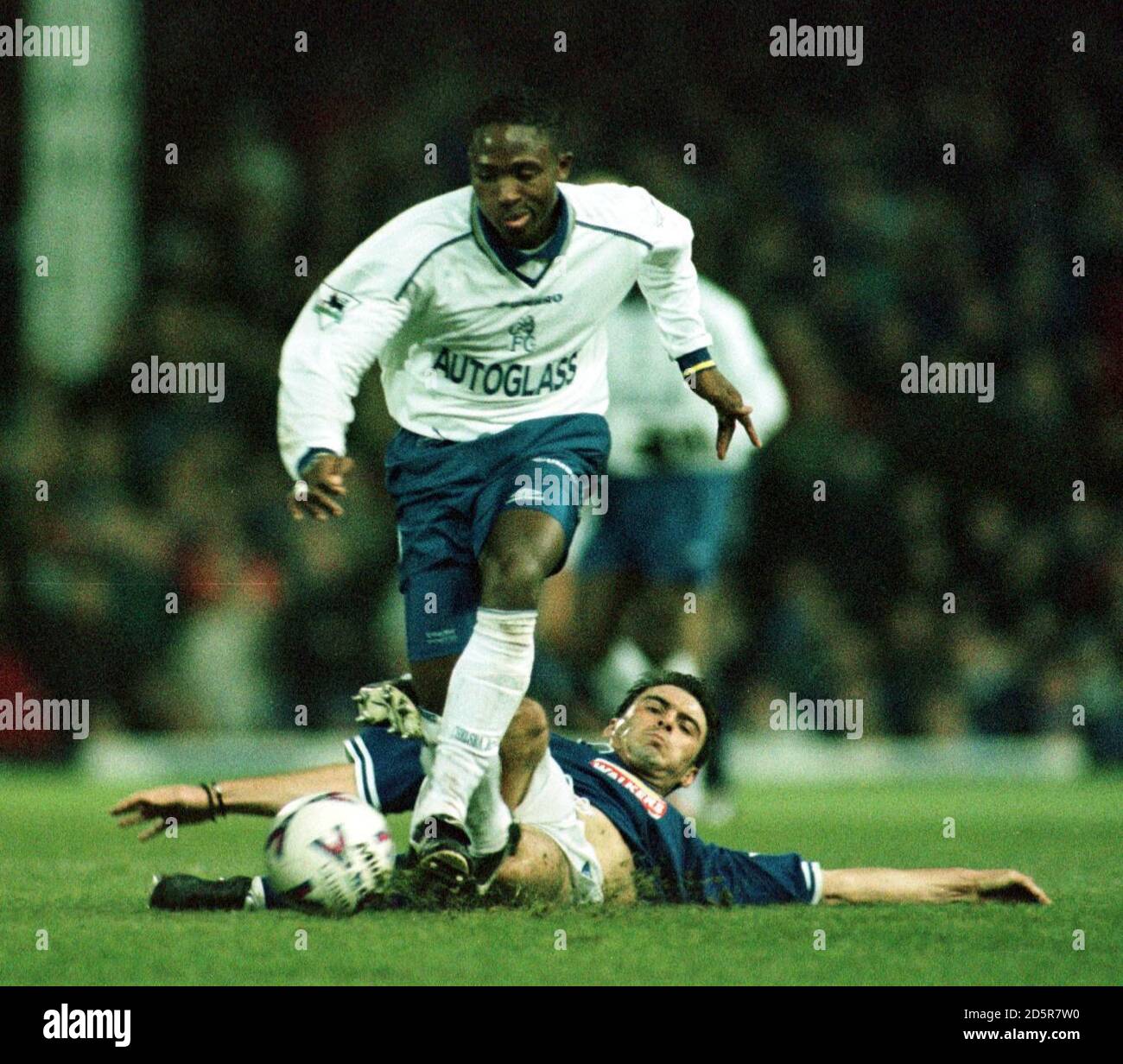 Chelsea's Celestine Babayaro (left) gets away from a tackle Stock Photo