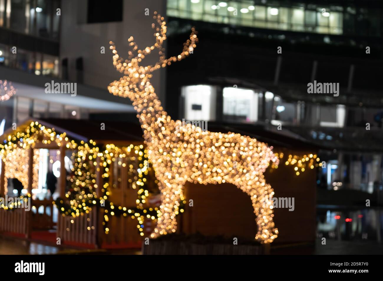 Blurred lights of christmas installation defocused lights of deer on