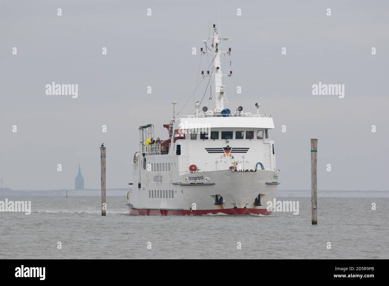 A ferry arriving on the mainland from the Fresian Islands. October 2020. Lower Saxony. Germany Stock Photo