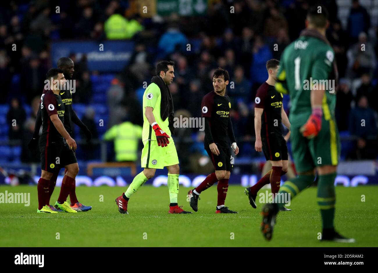 Manchester City's Sergio Aguero (left), Manchester City goalkeeper Claudio Bravo (centre) and Manchester City's David Silva (right) appear dejected after the final whistle Stock Photo