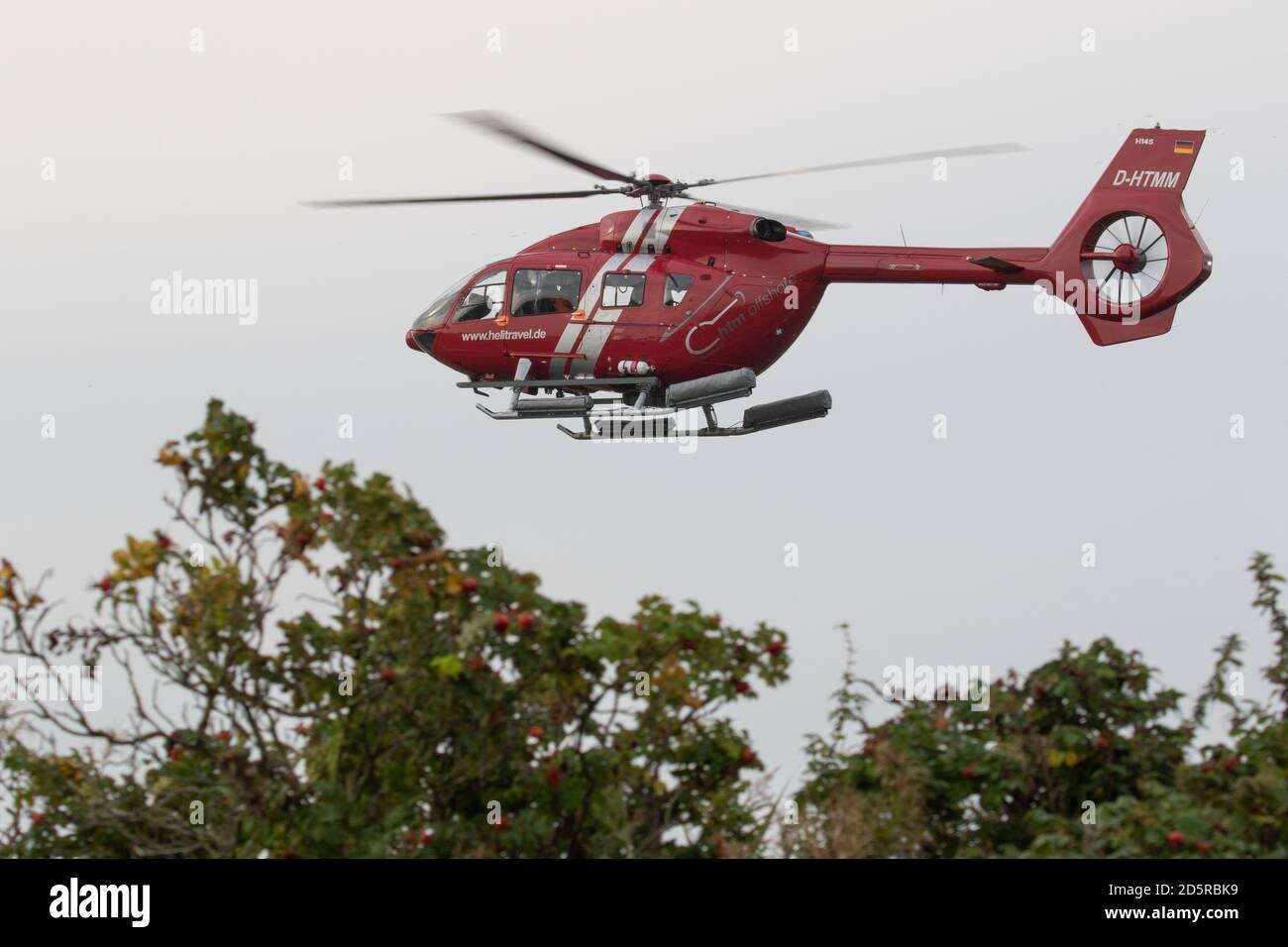 Helicopter ferrying passenger to and from the Frisian Islands. Lower Saxony. Germany. October 2020 Stock Photo