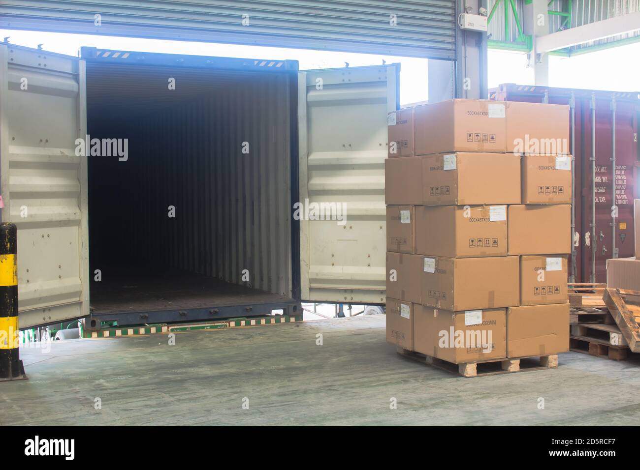 loading shipment carton boxes and goods on wooden pallet at loading