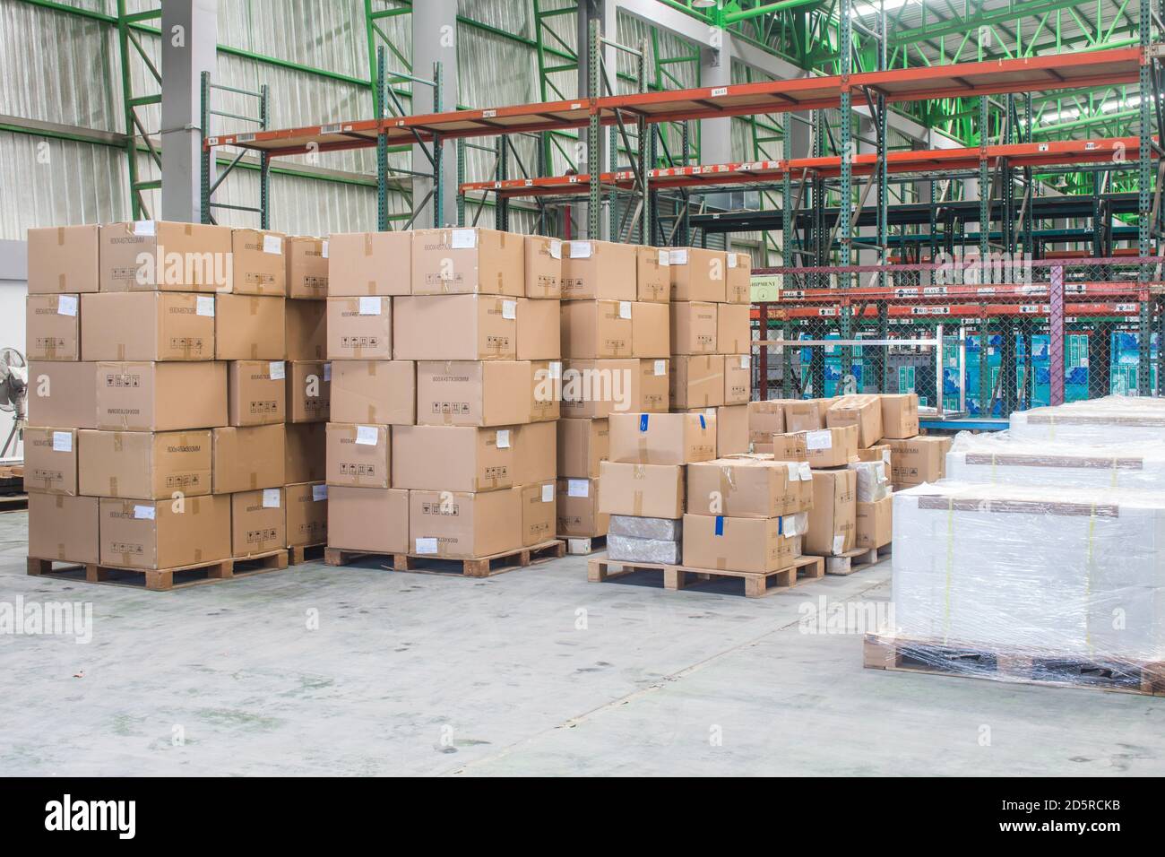 interior of warehouse. Rows of shelves with boxes Stock Photo - Alamy