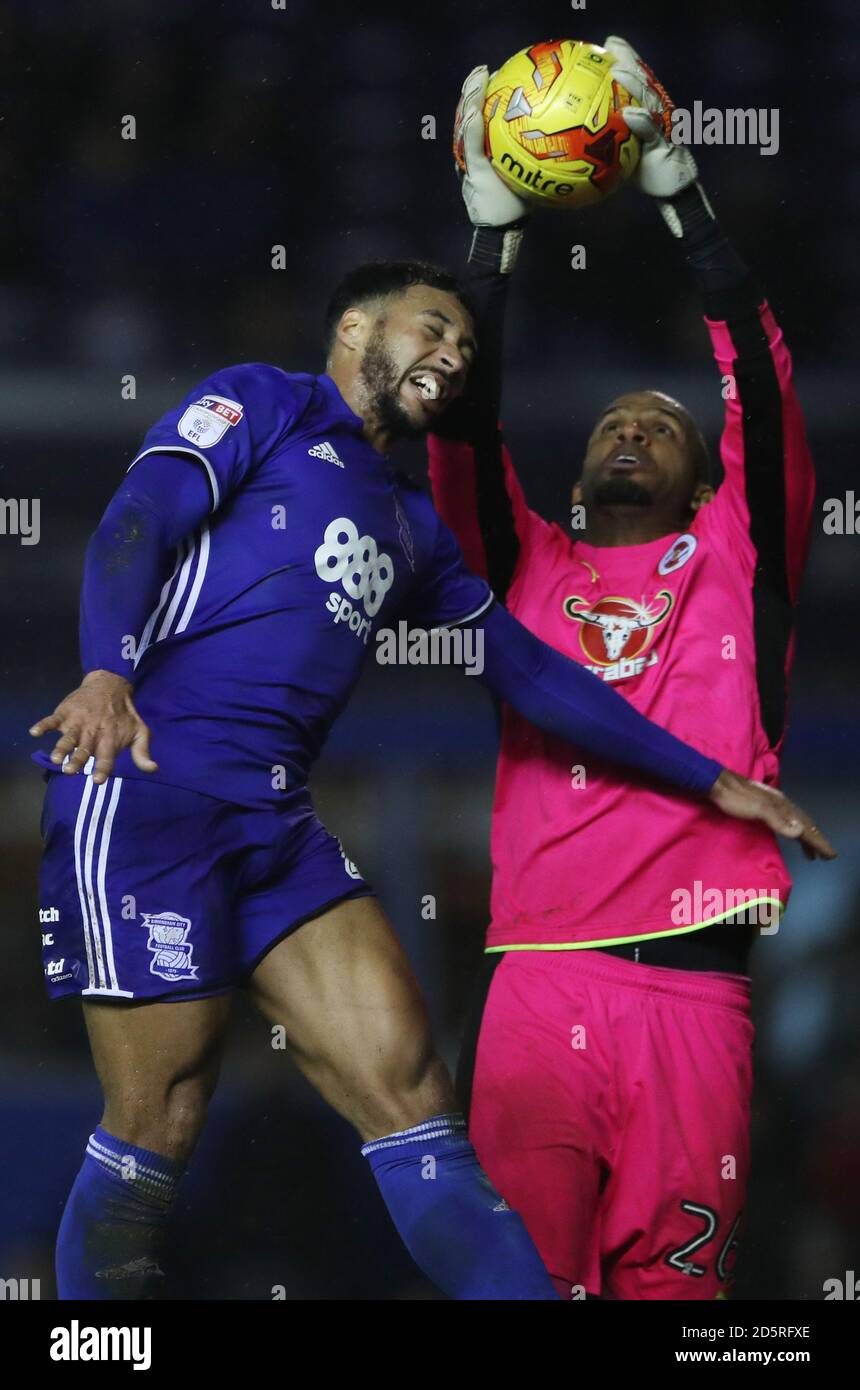 Birmingham City's David Davis jumps with Reading goalkeeper Ali Al-Habsi  Stock Photo