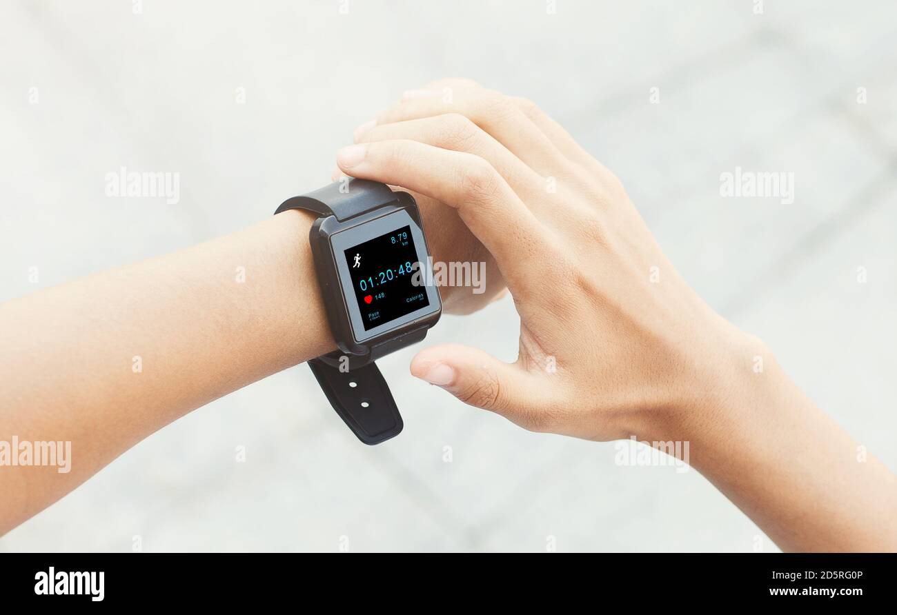 Checking run distance and steps online at training. Woman with fitness ...