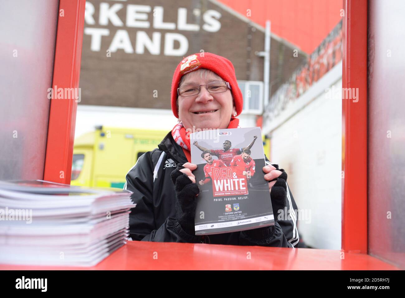 Programme Seller A programme seller at Swindon Town's County Ground Stock Photo - Alamy