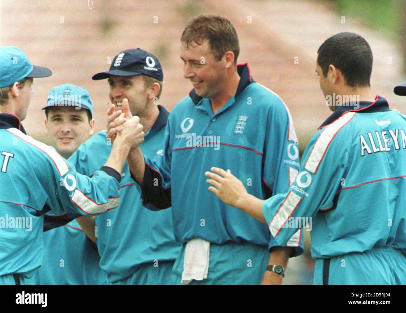 England's Angus Fraser is congratulated by his team mates for dismissing Bradman XI's Michael Hussey for 33. Stock Photo