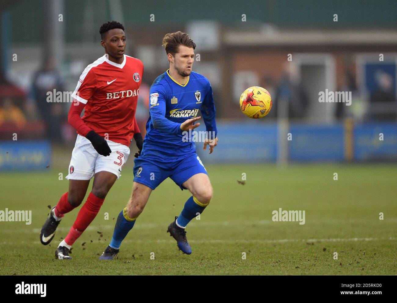 Charlton Athletic's Joe Aribo (left) and AFC Wimbledon's Jake Reeves ...