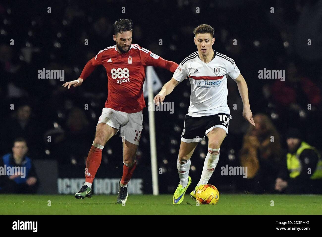 Nottingham Forest's Danny Fox (left) and Fulham's Tom Cairney (right) battle for the ball during the Sky Bet Championship match between Fulham and Nottingham Forest at Craven Cottage Stock Photo