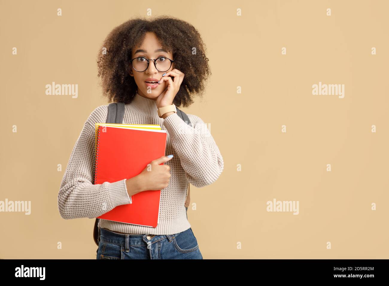 Excited human emotions. Amazed african american lady with glasses back to school Stock Photo