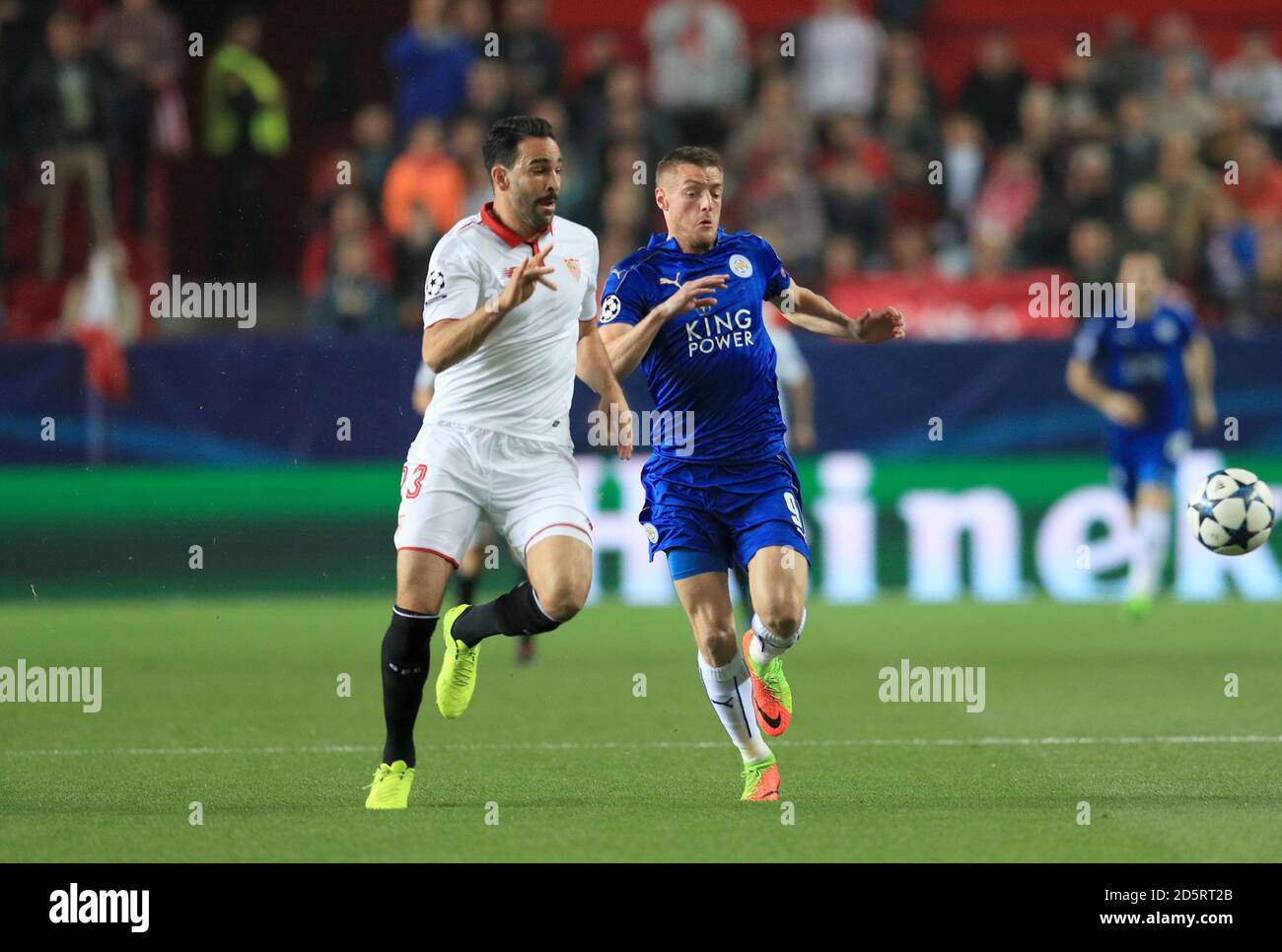 Sevilla's Adil Rami (left) and Leicester City's Jamie Vardy (right) battle for the ball Stock Photo